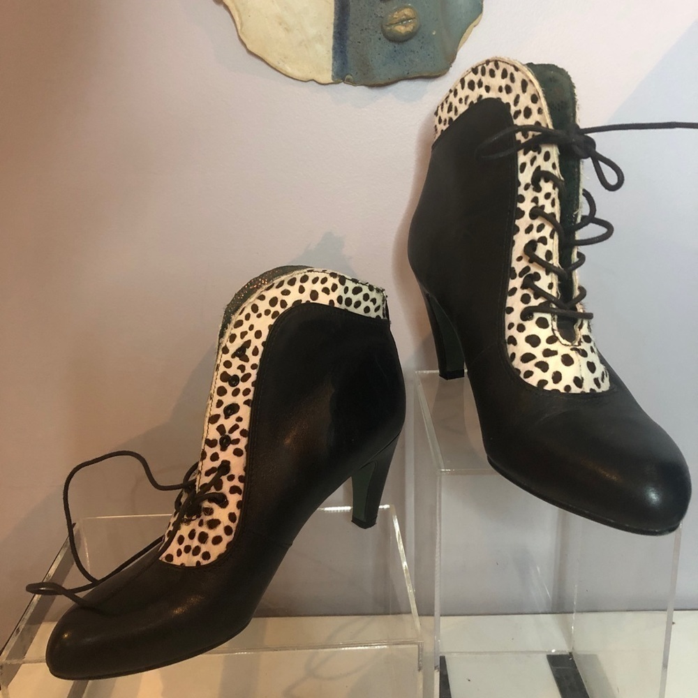 Poetic license boots size 39.5 leather with pony hair in a animal print.